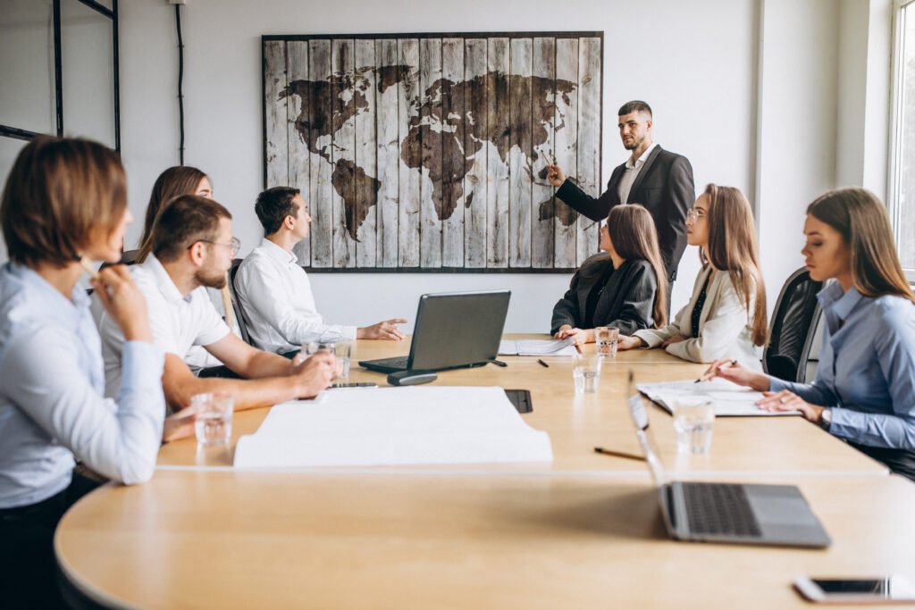 Nos services group of people working out business plan in an office
